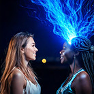 A couple of women looking at each other

Description automatically generated